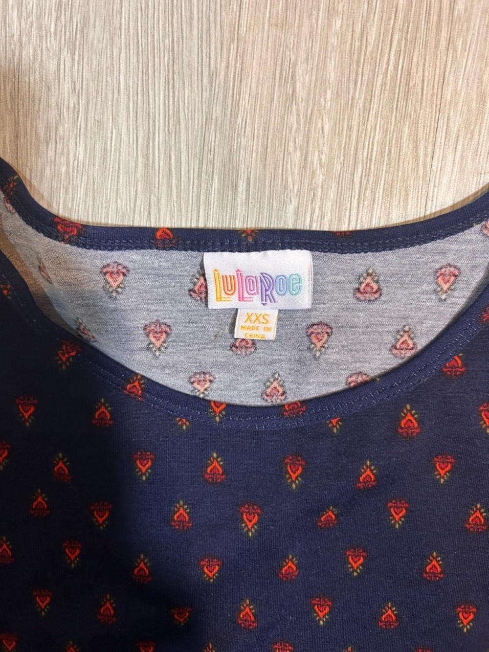 LuLaRoe Navy Top with Red & Orange Tiny Floral Motif - Picture 2 of 4